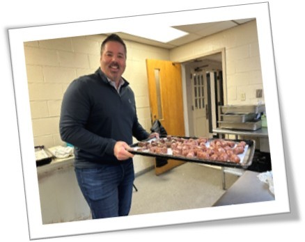 man carrying a tray of food